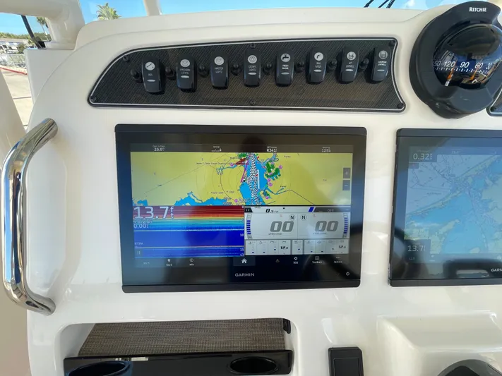  Yacht Photos Pics Grady-White Canyon 326 boat console with Garmin navigation system, year 2023.