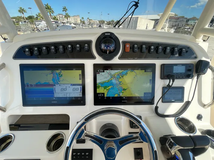  Yacht Photos Pics Grady-White Canyon 326 2023 boat console with navigation systems.