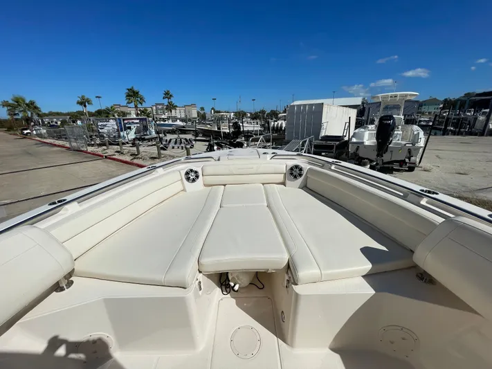  Yacht Photos Pics 2023 Grady-White Canyon 326 boat with luxurious seating area at the marina.