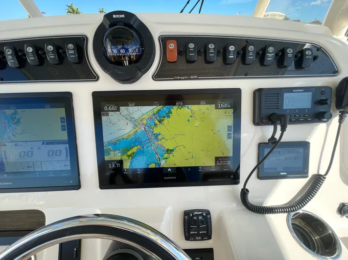  Yacht Photos Pics Dashboard of 2023 Grady-White Canyon 326 boat with navigation system.