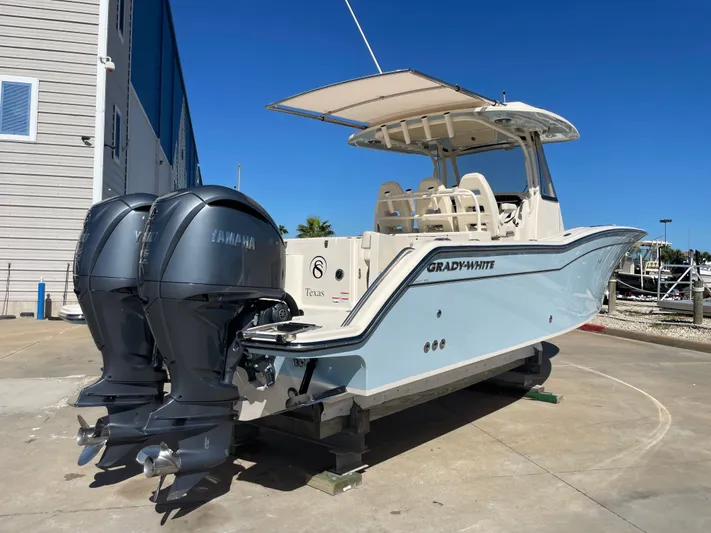  Yacht Photos Pics 2023 Grady-White Canyon 326 boat with Yamaha engines at a dock.