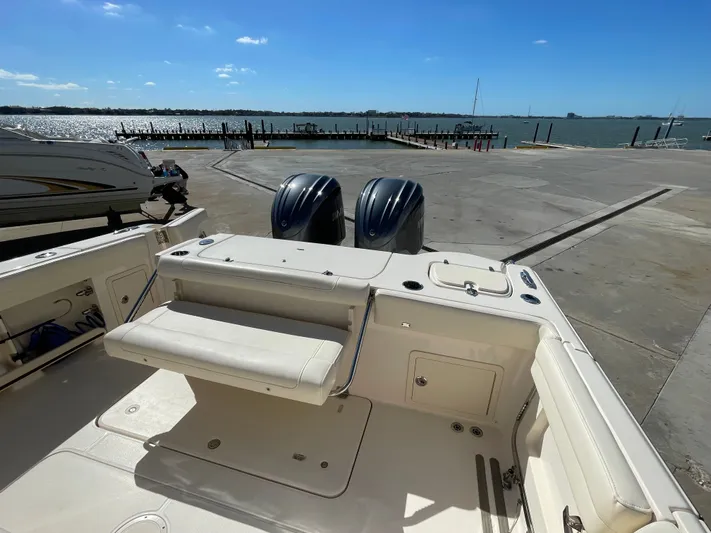  Yacht Photos Pics Grady-White Canyon 326 boat at dock overlooking the water.