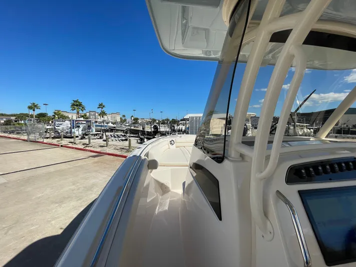  Yacht Photos Pics Grady-White Canyon 326 boat, 2023 model, docked under sunny skies.