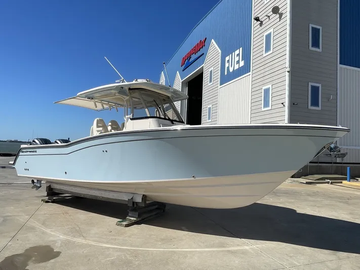  Yacht Photos Pics Grady-White Canyon 326 boat 2023 in front of a building.