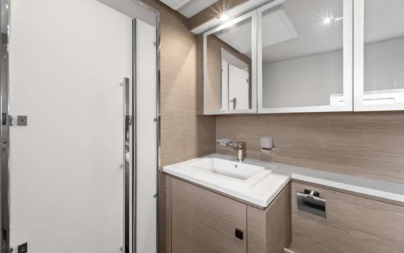 Mona Lisa Yacht Photos Pics Modern bathroom interior on 2024 Fountaine Pajot MY.6 yacht, featuring sleek design and fixtures.