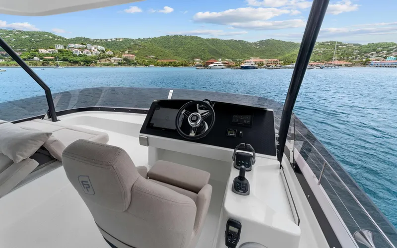 Mona Lisa Yacht Photos Pics 2024 Fountaine Pajot MY.6 yacht helm with scenic coastal view.