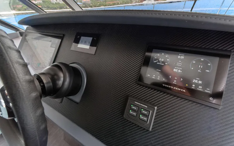 Mona Lisa Yacht Photos Pics 2024 Fountaine Pajot MY.6 helm with Volvo Penta display and navigation controls.