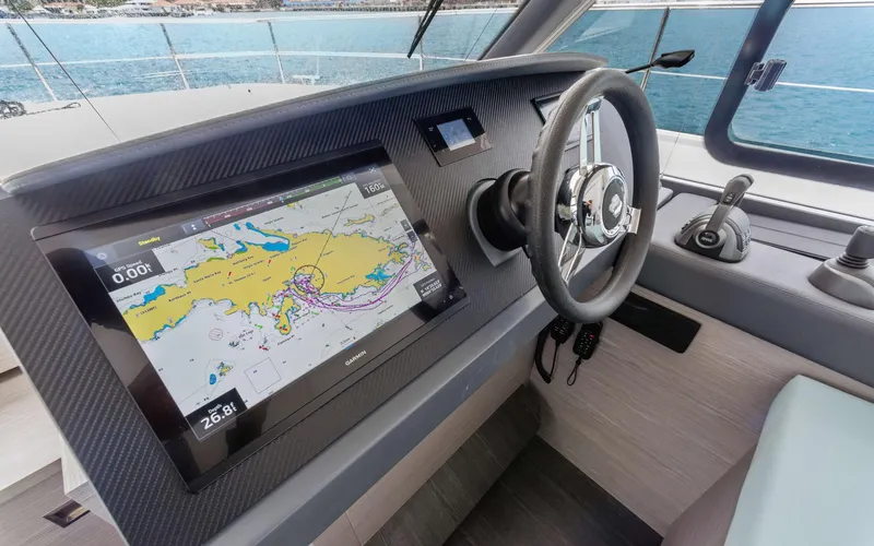 Mona Lisa Yacht Photos Pics 2024 Fountaine Pajot MY.6 helm with navigation display and steering wheel.