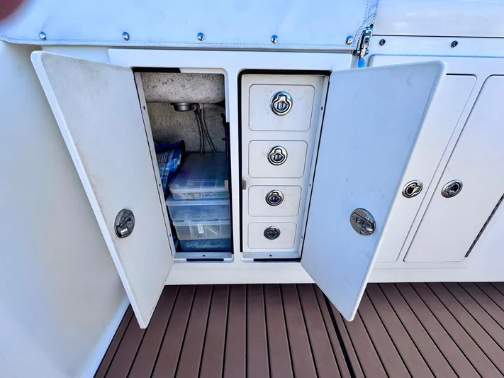 Triple Play Yacht Photos Pics 2005 Carolina Classic 35 boat storage compartments with drawers and shelves.