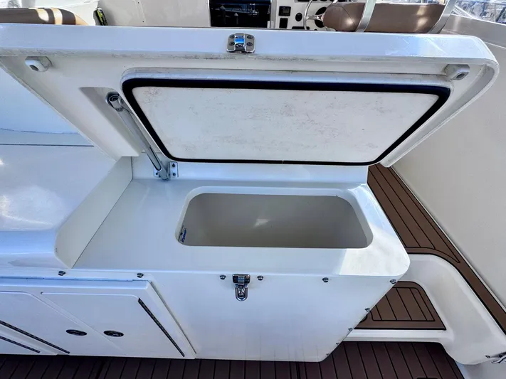 Triple Play Yacht Photos Pics Open storage compartment on a 2005 Carolina Classic 35 boat.