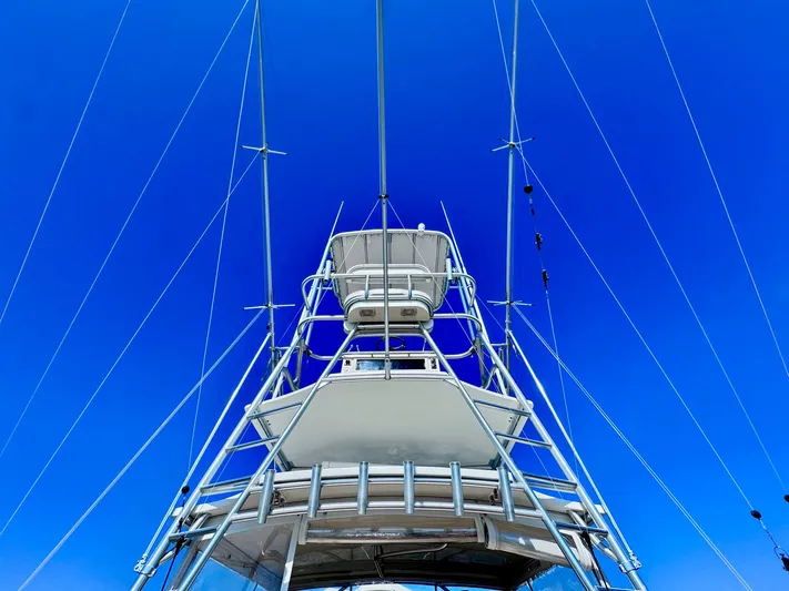 Triple Play Yacht Photos Pics Carolina Classic 35 boat tower against clear blue sky, 2005 model.