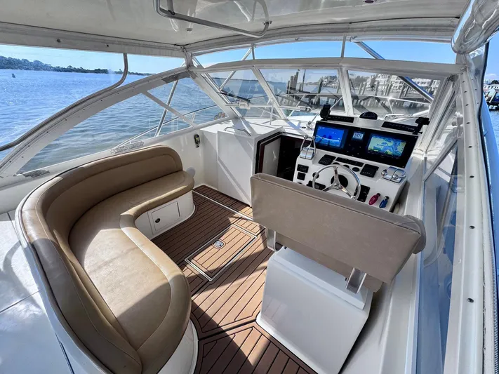 Triple Play Yacht Photos Pics 2005 Carolina Classic 35 boat interior with helm, seating, and navigation screens.