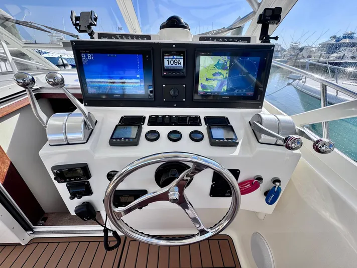 Triple Play Yacht Photos Pics 2005 Carolina Classic 35 boat helm with dual navigation screens and controls.