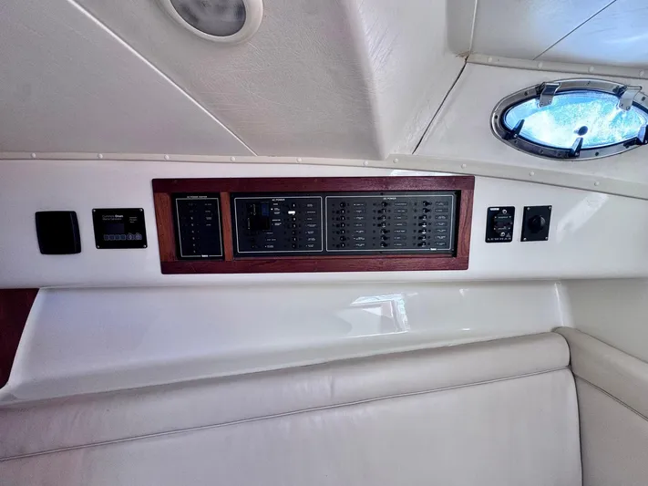 Triple Play Yacht Photos Pics 2005 Carolina Classic 35 boat interior with control panel and porthole.