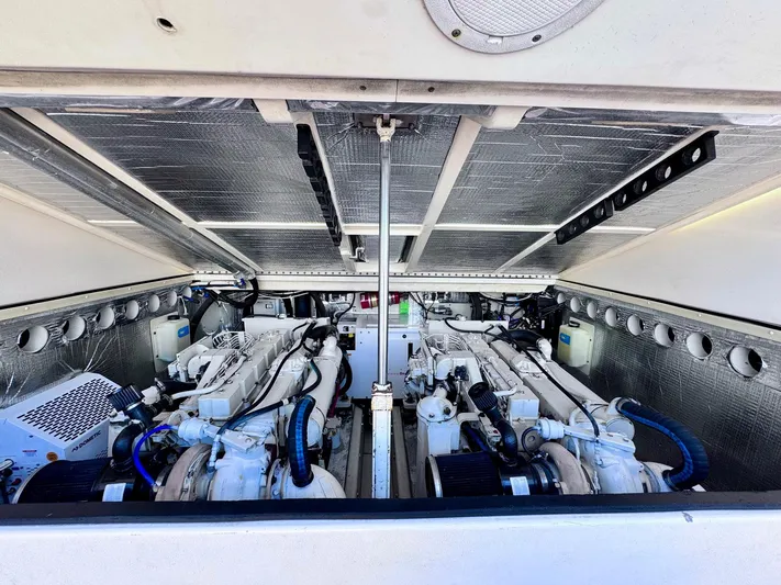 Triple Play Yacht Photos Pics Engine compartment of a 2005 Carolina Classic 35 boat, showcasing dual engines.