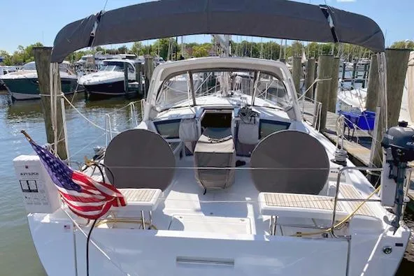  Yacht Photos Pics 2017 Beneteau Oceanis 41.1 sailboat docked, featuring spacious deck and American flag.