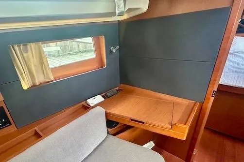  Yacht Photos Pics 2017 Beneteau Oceanis 41.1 interior with wooden desk and window view.