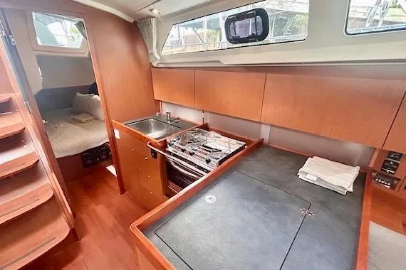  Yacht Photos Pics 2017 Beneteau Oceanis 41.1 yacht interior with kitchen and sleeping area.