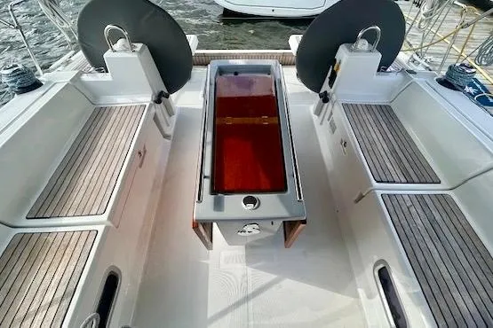  Yacht Photos Pics Cockpit of 2017 Beneteau Oceanis 41.1 sailboat with wooden seating and central table.