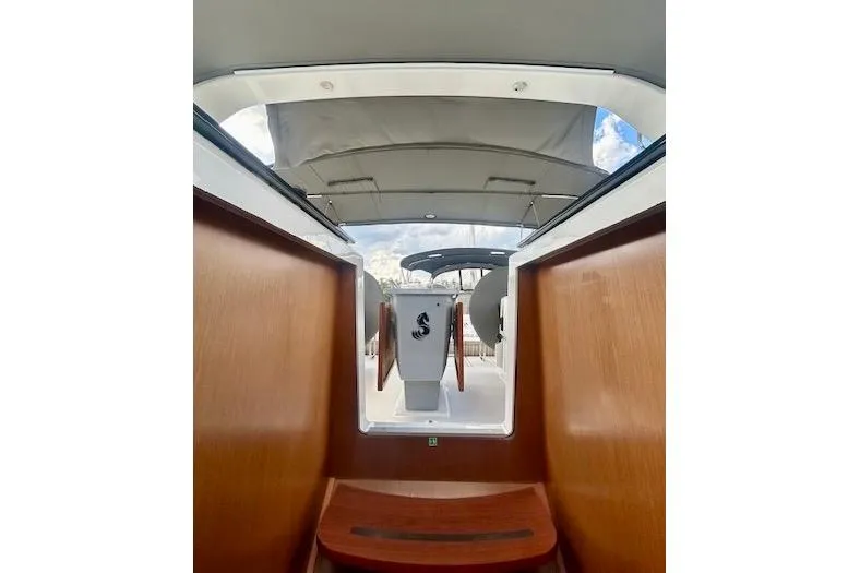  Yacht Photos Pics 2017 Beneteau Oceanis 41.1 yacht interior with wooden finish and open hatch view.