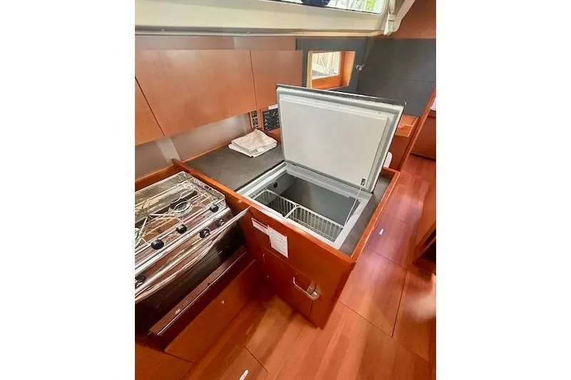  Yacht Photos Pics 2017 Beneteau Oceanis 41.1 yacht kitchen with open fridge and stove.
