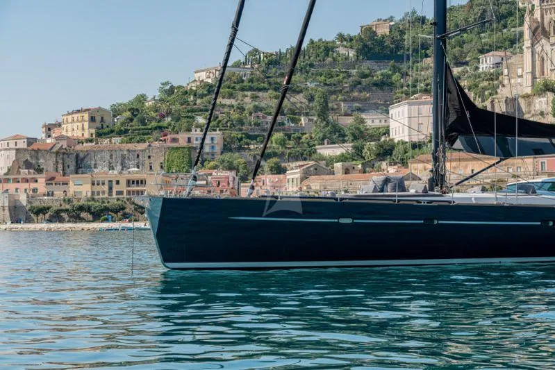 Atl 864 Yacht Photos Pics Sleek Marc Lombard 33m yacht from 1998 docked near scenic coastal town.