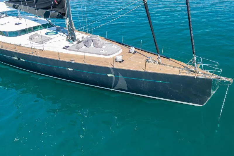 Atl 864 Yacht Photos Pics Luxurious 1998 Marc Lombard 33m yacht with sleek design on calm blue waters.