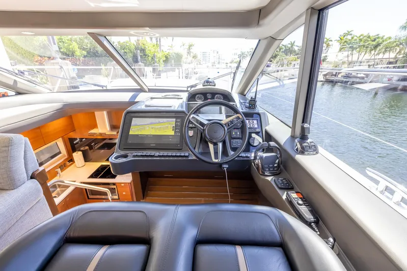 Quick Decision Yacht Photos Pics Modern helm of a 2020 Princess V50 yacht with advanced navigation system.