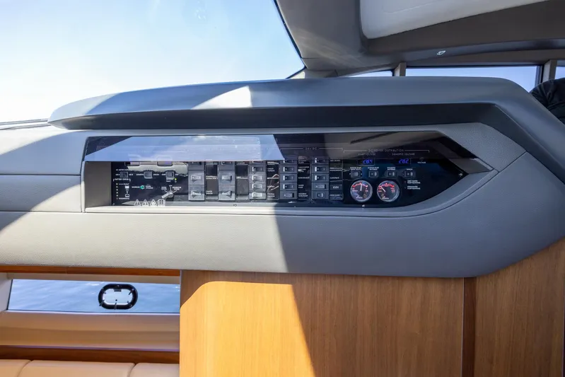 Quick Decision Yacht Photos Pics Control panel of a 2020 Princess V50 yacht with modern instrumentation.