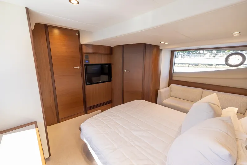 Quick Decision Yacht Photos Pics Luxurious bedroom interior of 2020 Princess V50 yacht with modern furnishings.