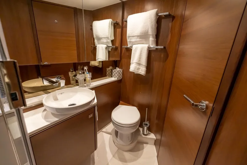 Quick Decision Yacht Photos Pics Luxurious bathroom in a 2020 Princess V50 yacht with modern amenities.