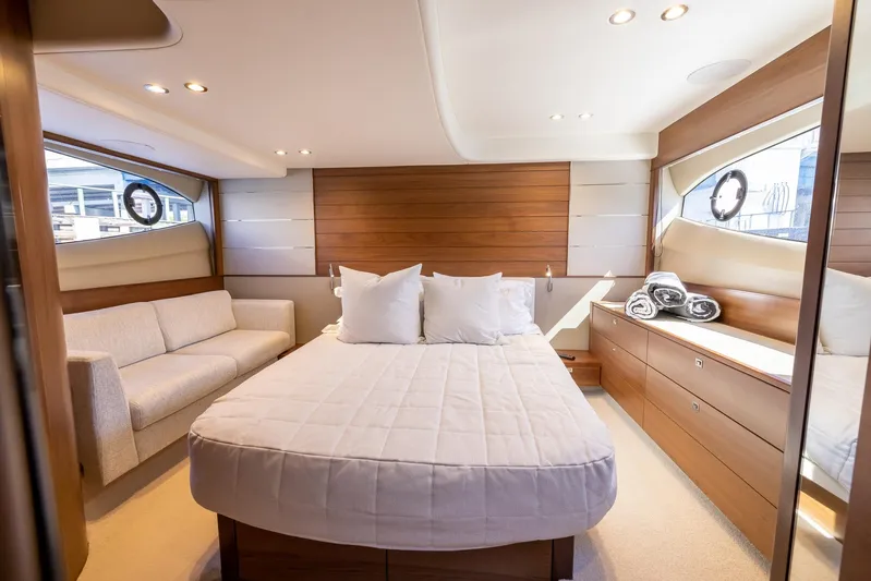 Quick Decision Yacht Photos Pics Luxurious bedroom interior of 2020 Princess V50 yacht with modern furnishings.