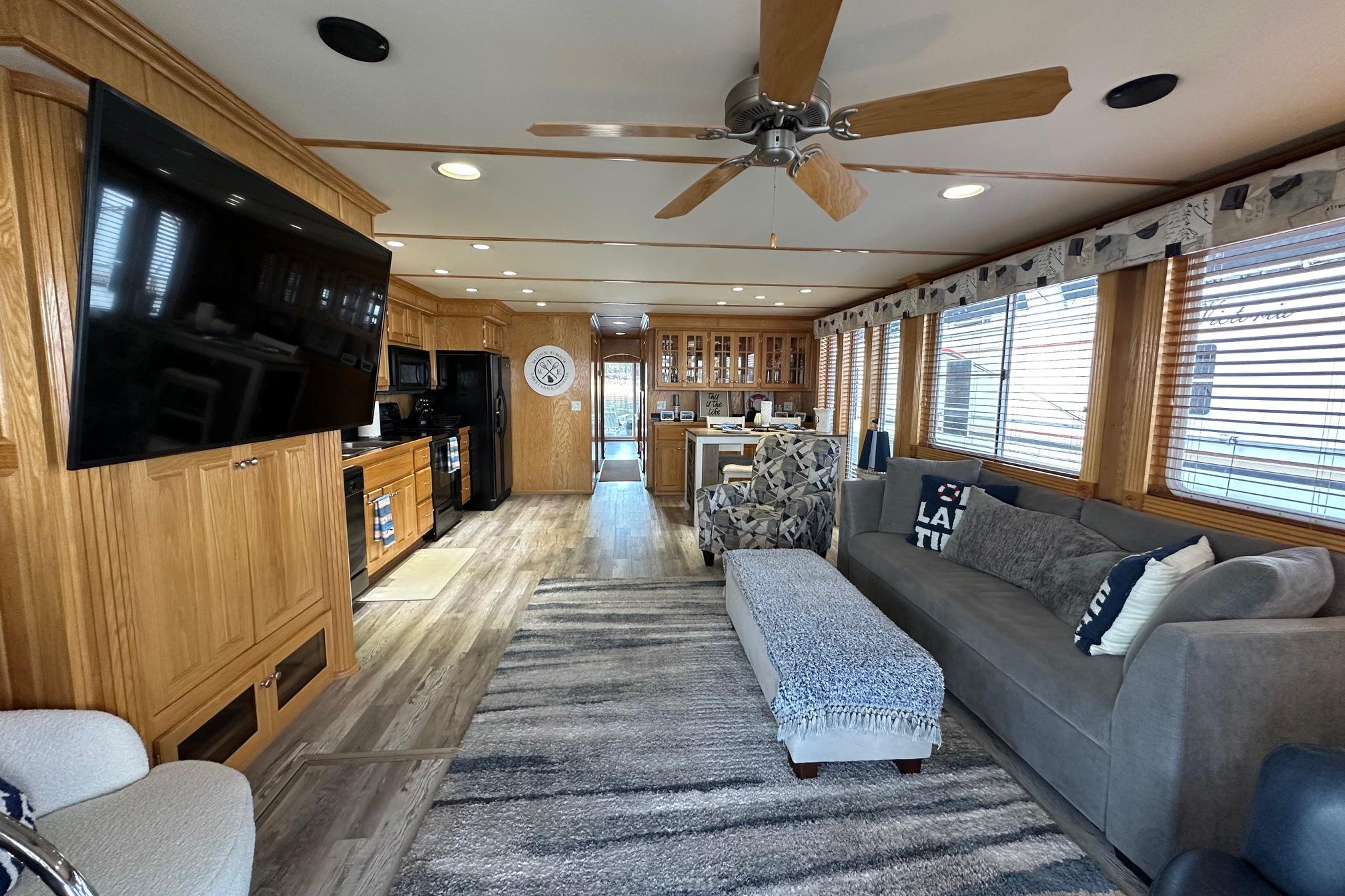 Spacious 2004 Lakeview 16x68 houseboat interior with modern kitchen and cozy living area.