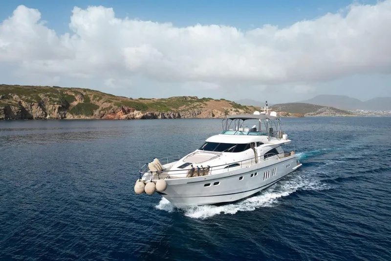  Yacht Photos Pics Luxury 2004 FAIRLINE SQUADRON 74 yacht cruising near scenic coastline.