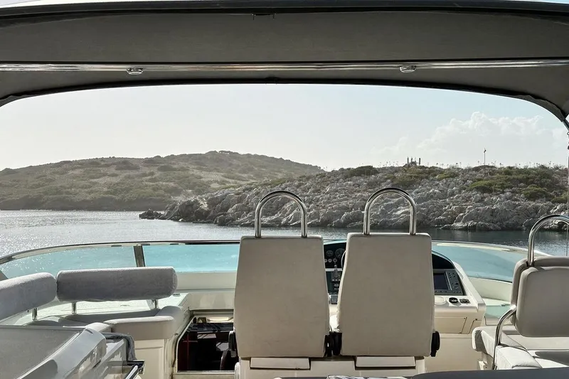  Yacht Photos Pics View from 2004 FAIRLINE SQUADRON 74 yacht, overlooking serene coastal landscape.