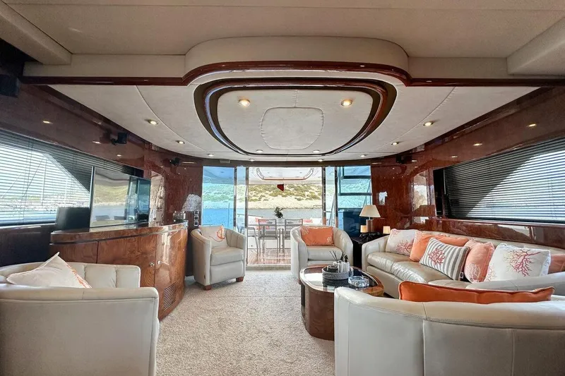  Yacht Photos Pics Luxurious interior of 2004 FAIRLINE SQUADRON 74 yacht with elegant seating and scenic views.