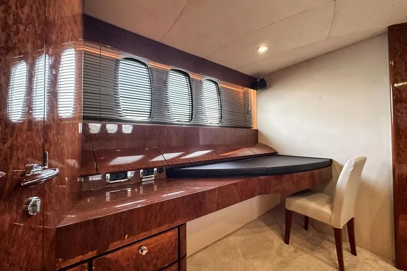  Yacht Photos Pics Luxurious interior of 2004 FAIRLINE SQUADRON 74 yacht with elegant wood finish and seating.