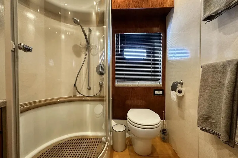  Yacht Photos Pics Luxurious bathroom in 2004 FAIRLINE SQUADRON 74 yacht with shower and toilet.