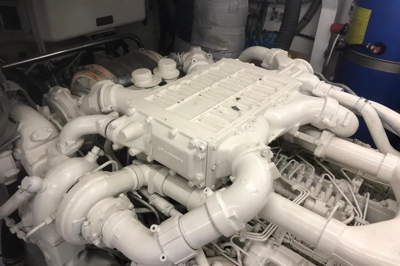  Yacht Photos Pics Engine room of 2004 FAIRLINE SQUADRON 74 yacht, showcasing complex machinery.