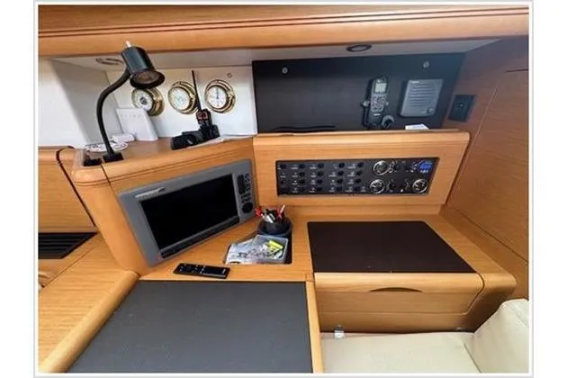  Yacht Photos Pics Navigation station of 2010 Jeanneau 57 yacht with control panel and instruments.