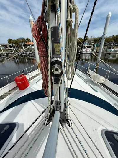 Dream Catcher Yacht Photos Pics Deck view of a 1998 Hunter 410 sailboat with ropes and marina background.