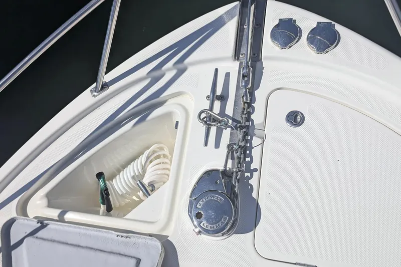 Bennett II Yacht Photos Pics 2004 Meridian 381 Sedan boat deck with anchor chain and storage compartment.