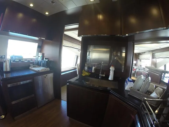  Yacht Photos Pics Luxurious kitchen interior of a 2008 Azimut 95 yacht with modern appliances.