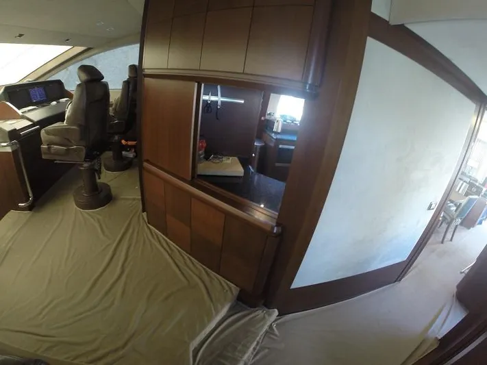  Yacht Photos Pics Interior of 2008 Azimut 95 yacht with wooden cabinetry and captain's chair.