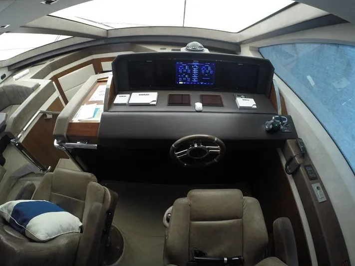  Yacht Photos Pics Luxurious 2008 Azimut 95 yacht helm with modern navigation controls and plush seating.