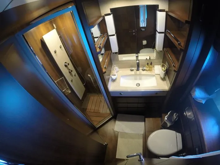  Yacht Photos Pics Luxurious bathroom in a 2008 Azimut 95 yacht, featuring modern fixtures and elegant wood finishes.