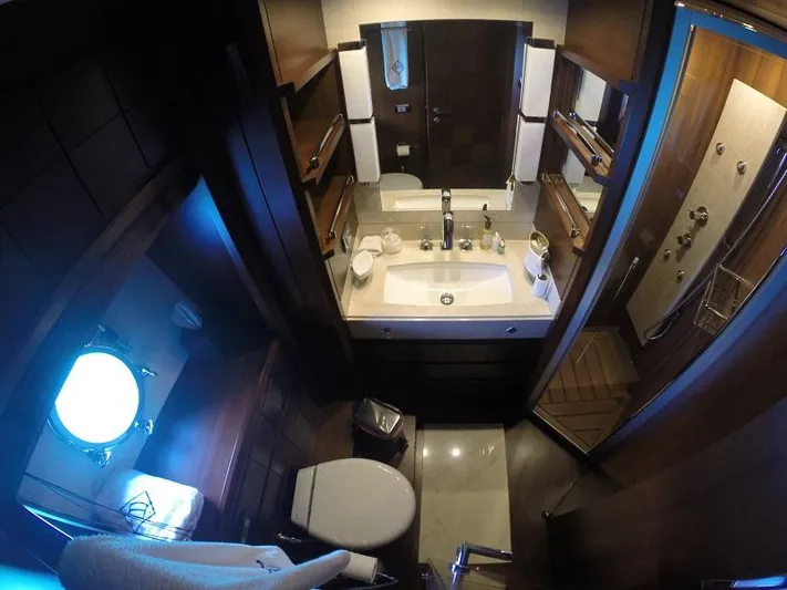  Yacht Photos Pics Luxurious bathroom on a 2008 Azimut 95 yacht, featuring elegant wood finishes and modern amenities.