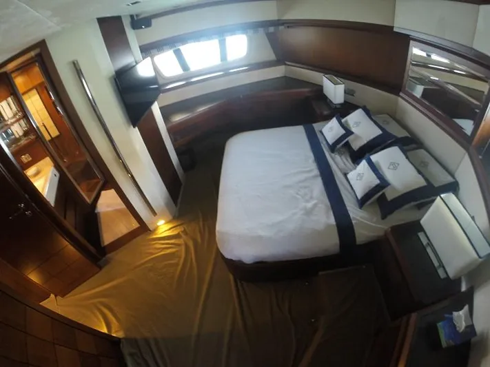  Yacht Photos Pics Luxurious bedroom interior of 2008 Azimut 95 yacht with elegant bedding and wood accents.