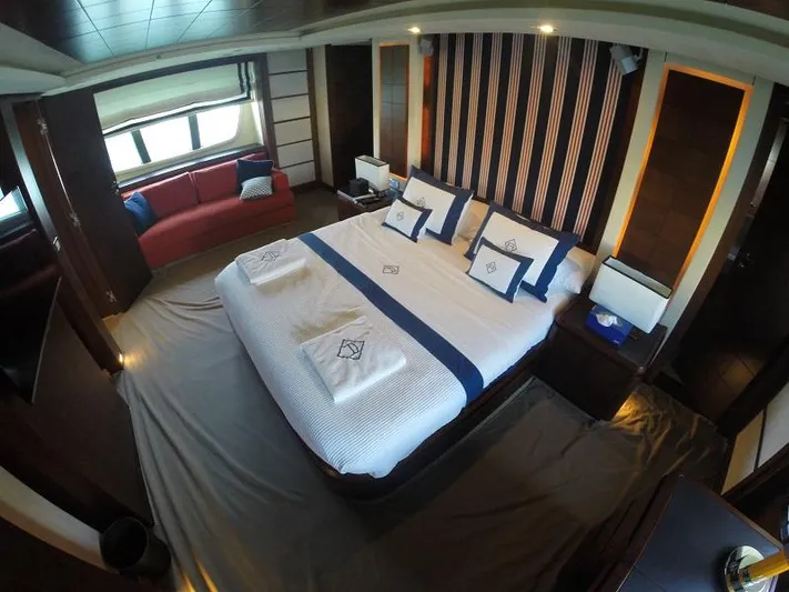  Yacht Photos Pics Luxurious bedroom interior of 2008 Azimut 95 yacht with elegant bedding and modern decor.