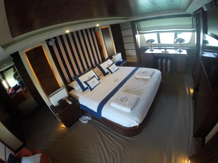  Yacht Photos Pics Luxurious bedroom interior on 2008 Azimut 95 yacht, featuring elegant bedding and modern decor.